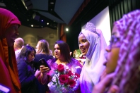 Briana Sanchez / Tribune Anisa Abdulahi prepares to take photos with friends and family after she is announced homecoming queen Monday night at Willmar Senior High School. Coronation was held in the theatre at 8 p.m. The king and queen were announced along with the prince and princess.